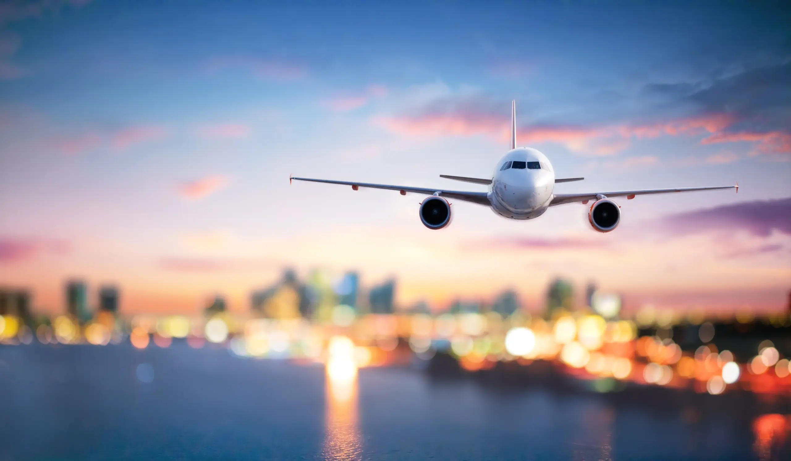 Airplane flying over city