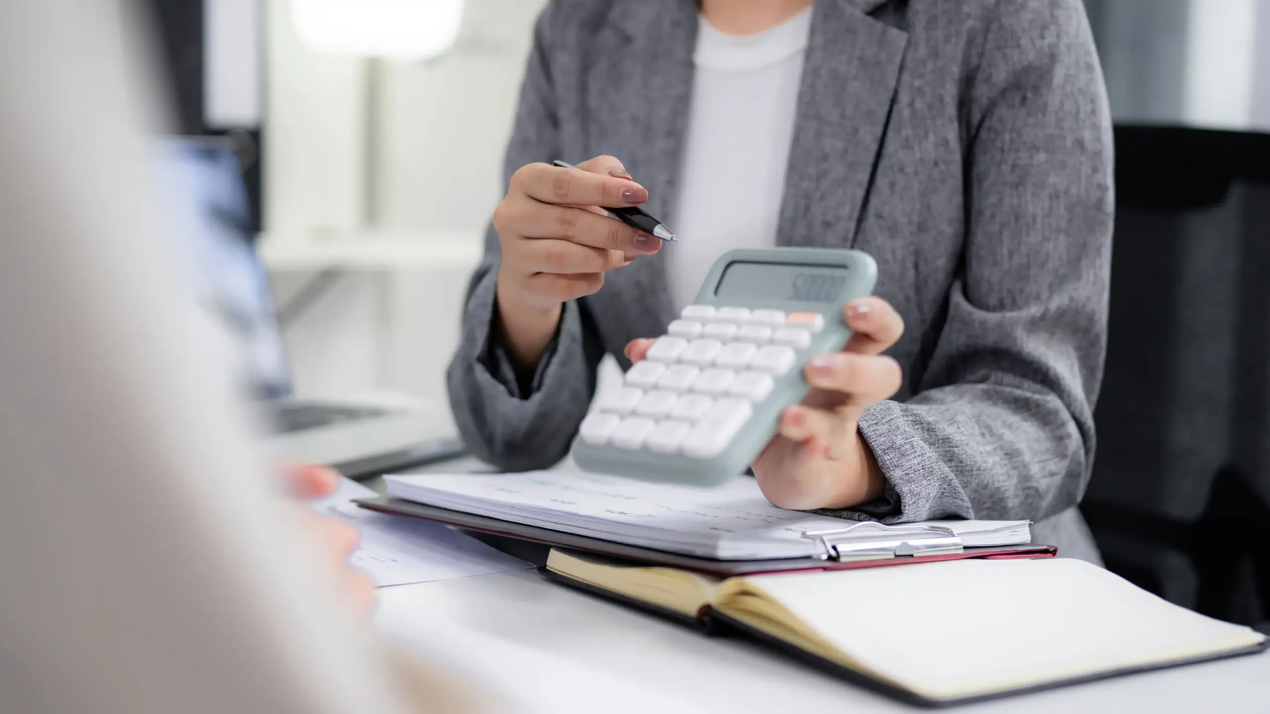 Woman with calculator